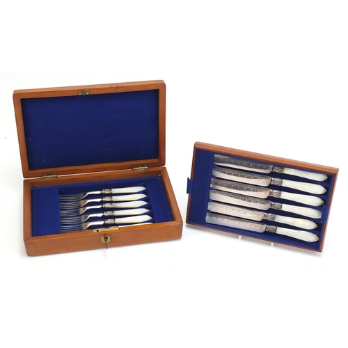 822 - Set of six silver plated cake knives and forks with mother of pearl handles, housed in a fitted waln... 