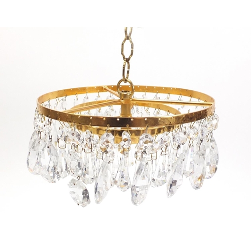 1076 - Gilt brass three tier bag chandelier with cut glass drops, 20cm in diameter