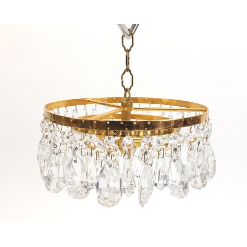 1076 - Gilt brass three tier bag chandelier with cut glass drops, 20cm in diameter