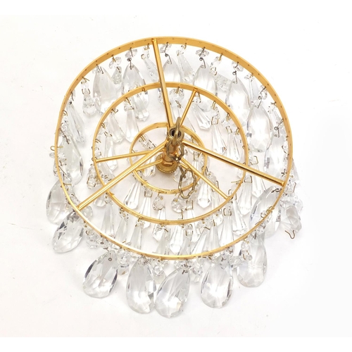 1076 - Gilt brass three tier bag chandelier with cut glass drops, 20cm in diameter