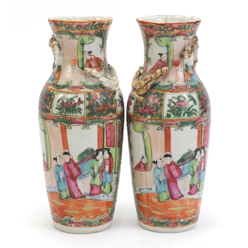 304 - Pair of Chinese Canton porcelain vases with relief dragons, each hand painted in the famile rose pal... 