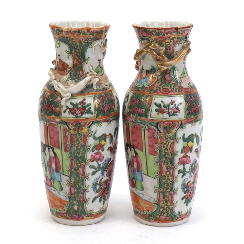 304 - Pair of Chinese Canton porcelain vases with relief dragons, each hand painted in the famile rose pal... 