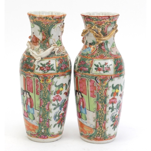 304 - Pair of Chinese Canton porcelain vases with relief dragons, each hand painted in the famile rose pal... 