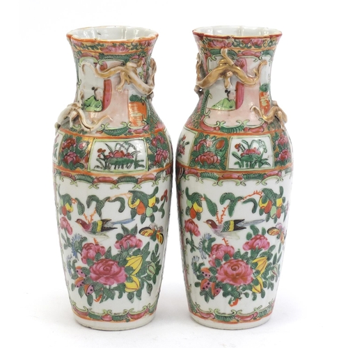 304 - Pair of Chinese Canton porcelain vases with relief dragons, each hand painted in the famile rose pal... 