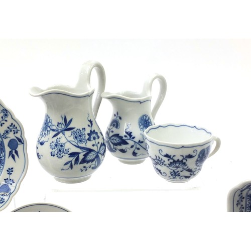 212 - Hutschenreuther tea and dinner ware to include jugs, cups, saucers, soup bowls decorated in the Blue... 