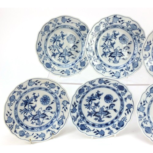 856 - Eleven Meissen tea plates, each hand painted in the Blue Onion pattern, crossed sword marks to the b... 