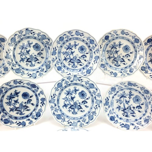 856 - Eleven Meissen tea plates, each hand painted in the Blue Onion pattern, crossed sword marks to the b... 