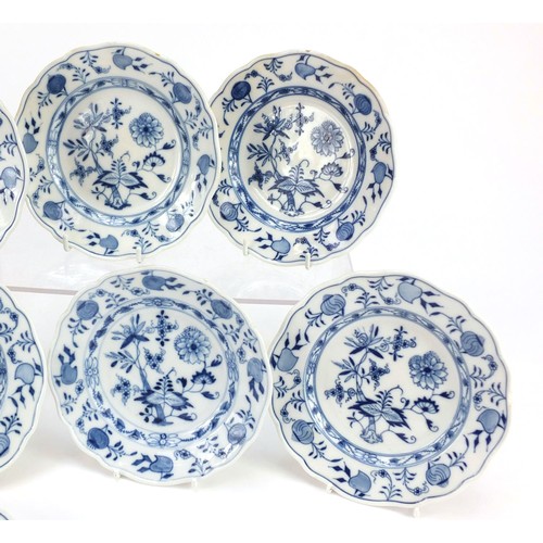 856 - Eleven Meissen tea plates, each hand painted in the Blue Onion pattern, crossed sword marks to the b... 