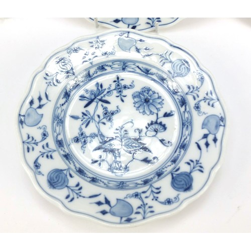 856 - Eleven Meissen tea plates, each hand painted in the Blue Onion pattern, crossed sword marks to the b... 