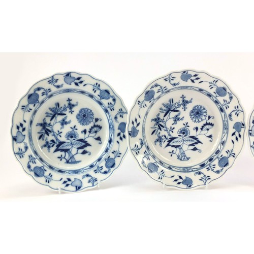 855 - Four Meissen soup plates, each hand painted in the Blue Onion pattern, crossed sword marks to the ba... 