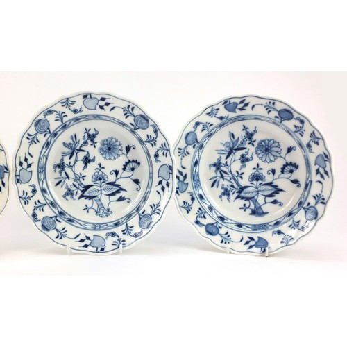 855 - Four Meissen soup plates, each hand painted in the Blue Onion pattern, crossed sword marks to the ba... 