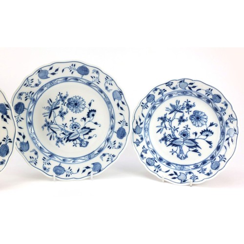 430 - Three Meissen shallow bowls and a plate, each hand painted in the Blue Onion pattern, crossed sword ... 