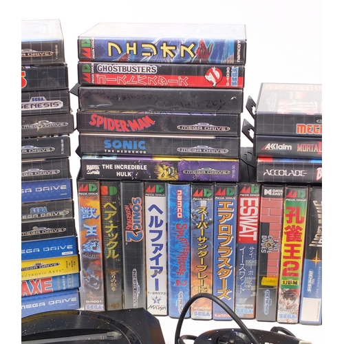 1381 - Two Sega Megadrives and a collection of games including Mortal Kombat II, Buck Rogers and Golden Axe