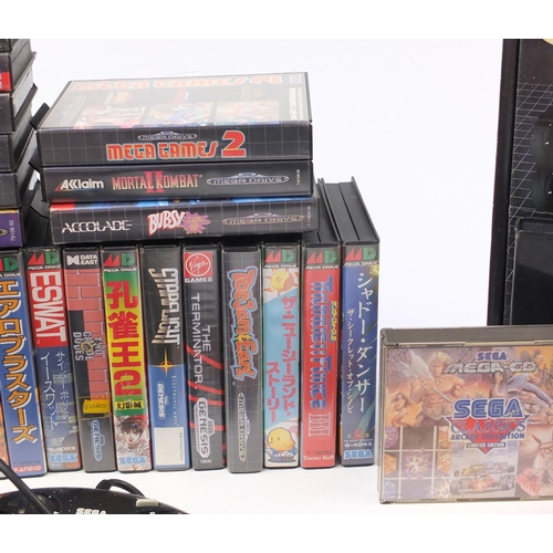 1381 - Two Sega Megadrives and a collection of games including Mortal Kombat II, Buck Rogers and Golden Axe