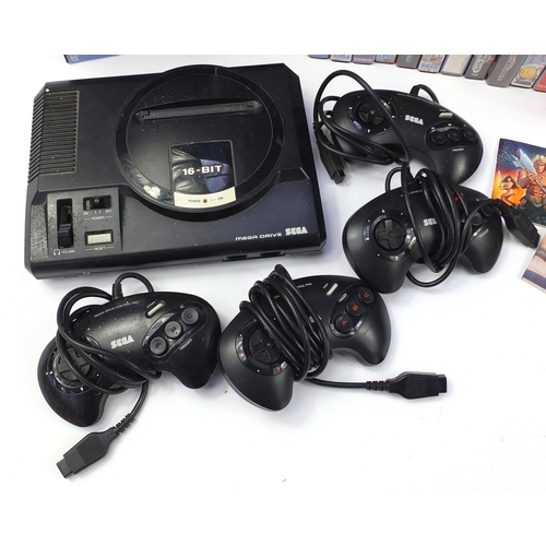 1381 - Two Sega Megadrives and a collection of games including Mortal Kombat II, Buck Rogers and Golden Axe