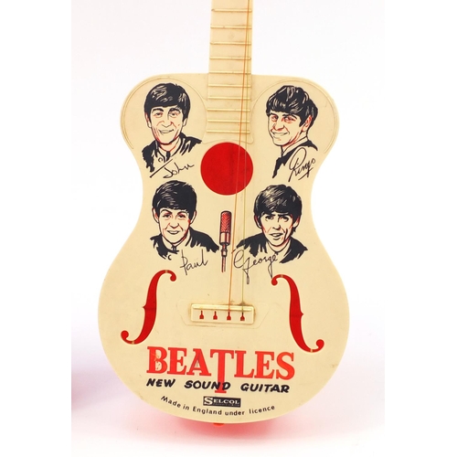 867 - Two vintage Beatles guitars by Selcol comprising New Sound guitar and Big Six, the largest 79cm in l... 