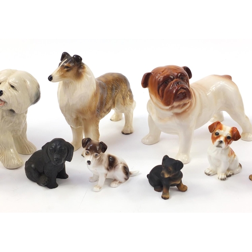 1558 - Porcelain dogs including Coppercraft and Melba ware together with one other, the largest 20.5cm in l... 