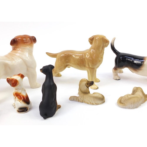 1558 - Porcelain dogs including Coppercraft and Melba ware together with one other, the largest 20.5cm in l... 