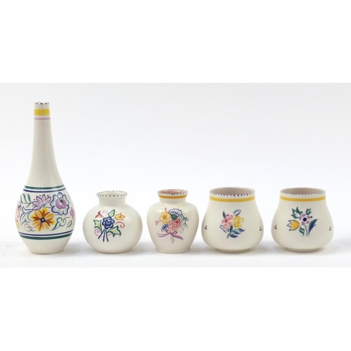 1524 - Poole Pottery including vases, each hand painted with flowers, the largest 26cm high