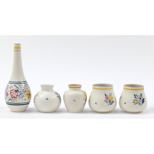 1524 - Poole Pottery including vases, each hand painted with flowers, the largest 26cm high