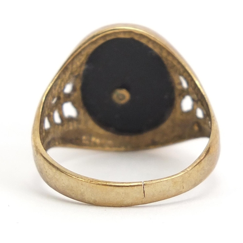 256 - 9ct gold and black onyx Playboy signet ring, size K, 2.4g