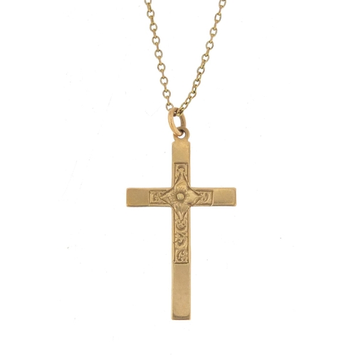 904 - 9ct gold cross pendant, 3.2cm in length, 1.0g on a gold plated necklace