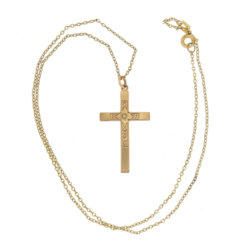 904 - 9ct gold cross pendant, 3.2cm in length, 1.0g on a gold plated necklace