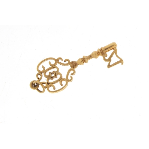 1228 - 9ct gold 21st birthday key pendant, 3.5cm in length, 2.0g