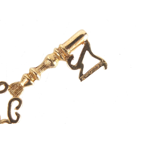 1228 - 9ct gold 21st birthday key pendant, 3.5cm in length, 2.0g