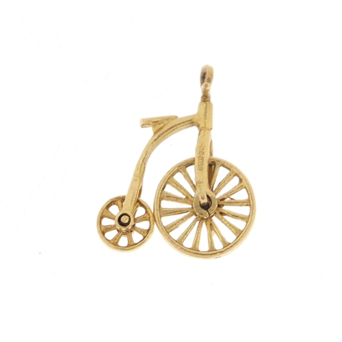 1058 - 9ct gold penny farthing charm, 2.2cm in length, 2.5g