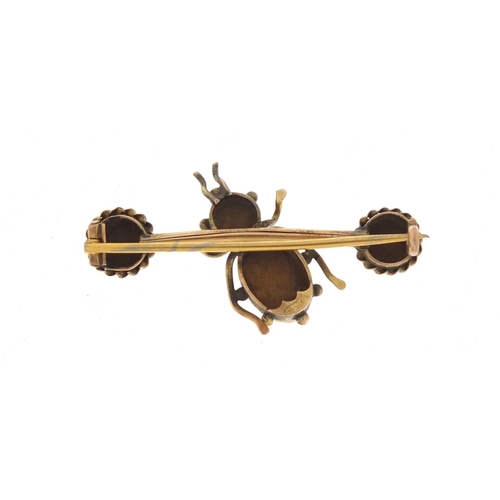 56 - 12ct gold and tiger's eye insect brooch, 4cm in length, 4.2g