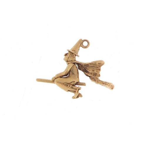 1102 - 9ct gold witch on a broomstick charm, 2.3cm in length, 2.3g