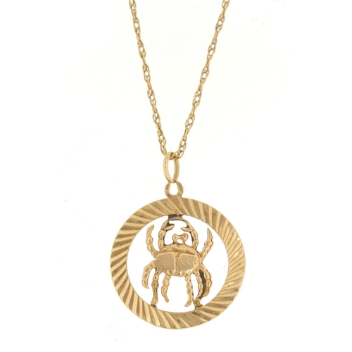 791 - 9ct gold zodiac Cancer pendant, 2.5cm in diameter, 2.1g, on an unmarked gold necklace, 2.5g