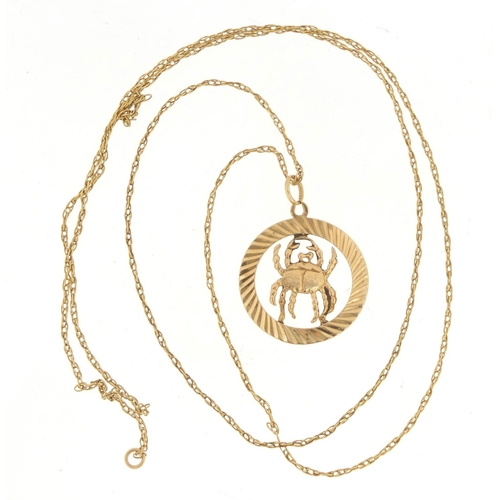 791 - 9ct gold zodiac Cancer pendant, 2.5cm in diameter, 2.1g, on an unmarked gold necklace, 2.5g