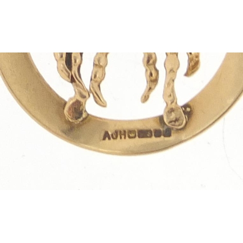 791 - 9ct gold zodiac Cancer pendant, 2.5cm in diameter, 2.1g, on an unmarked gold necklace, 2.5g