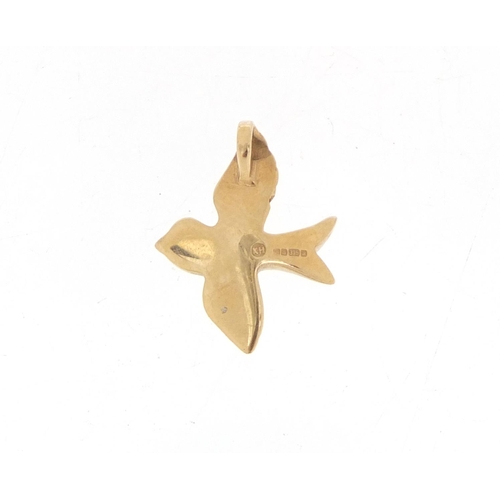 1014 - 9ct gold bird pendant, set with a diamond, 1.6cm in length, 1.7g