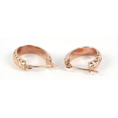 960 - Pair of gold coloured metal hoop earrings, 1.6cm in length, 0.6g