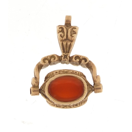 355 - Victorian gold coloured metal hardstone spinner fob, 2.2cm high, 4.0g