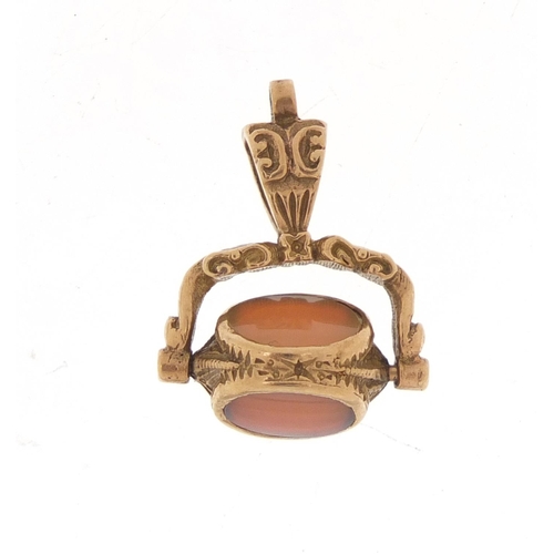 355 - Victorian gold coloured metal hardstone spinner fob, 2.2cm high, 4.0g