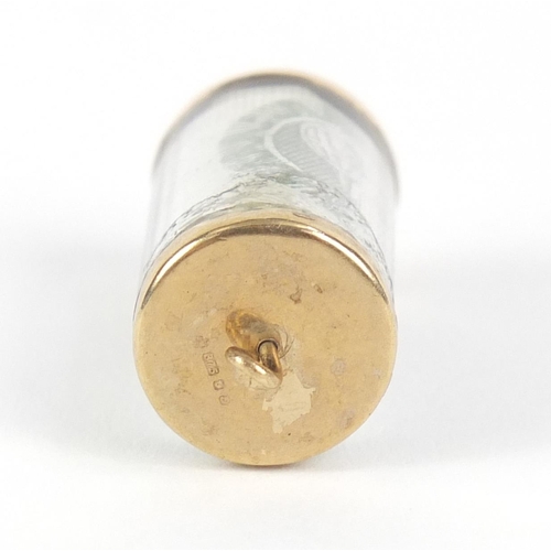 729 - 9ct gold emergency one pound note charm, 2.5cm in length, 3.3g