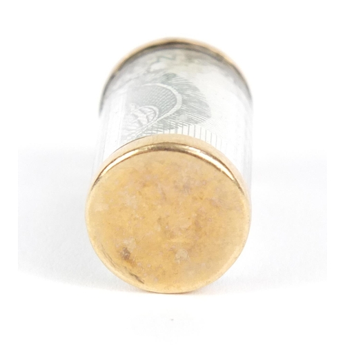 729 - 9ct gold emergency one pound note charm, 2.5cm in length, 3.3g