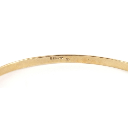 23 - 9ct gold opal and diamond bangle, housed in an Oswing & Co box, 6cm in diameter, 9.2g