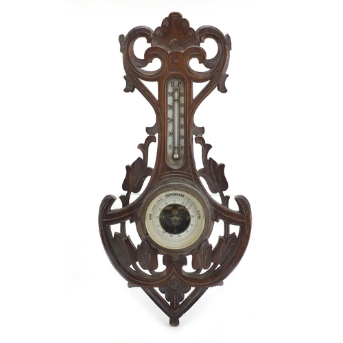 1066 - Carved Black Forest wall barometer and thermometer with Cyrillic script, 46cm high