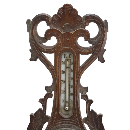 1066 - Carved Black Forest wall barometer and thermometer with Cyrillic script, 46cm high