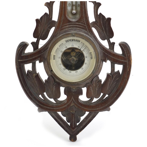 1066 - Carved Black Forest wall barometer and thermometer with Cyrillic script, 46cm high