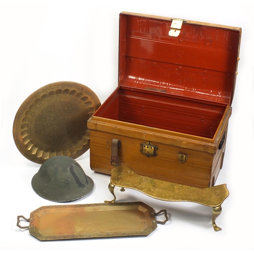 1560 - Metalware comprising a vintage trunk, brass footman, military tin helmet and two Indian trays, the l... 