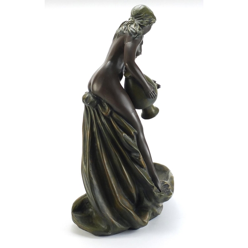 889 - Art Nouveau design centrepiece in the form of a maiden holding a vessel, 53cm high