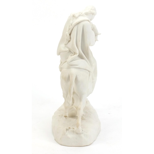 860 - Parian figure group of mother and child on donkey back, 26cm high