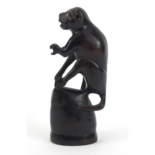 1152 - Tribal hardwood carving of a monkey, 12.5cm high