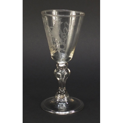 1 - 17th/18th century wine glass engraved with a coat of arms, having a baluster stem enclosing a tear a... 